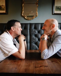 Tom rains and richard shakeshaft looking at each other in the Beehive.